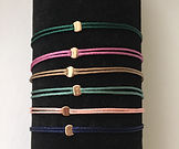 <ALT=koy desgin charity bracelet"