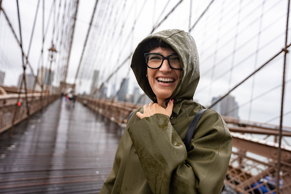 Happy Tourist Laughing under the Rain on Brooklyn Bridge_edited.jpg
