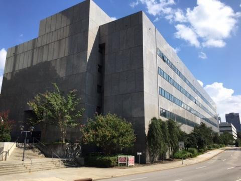 A photo of a tall gray building in Raleigh where government offices are located