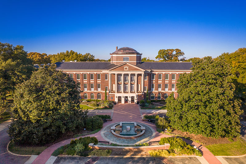A bird's eye view of Johnson Hall and the fountain in summer