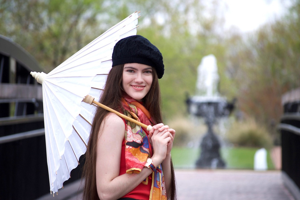 Lila with an umbrella