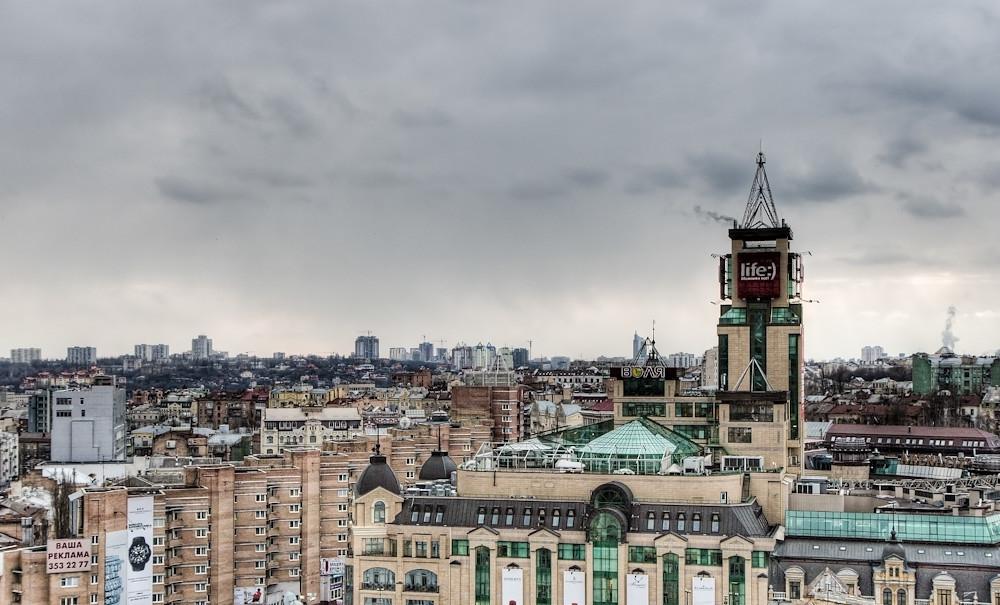 Tall buildings with a dark sky in the background