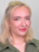 Anna smiling at the camera against a white background