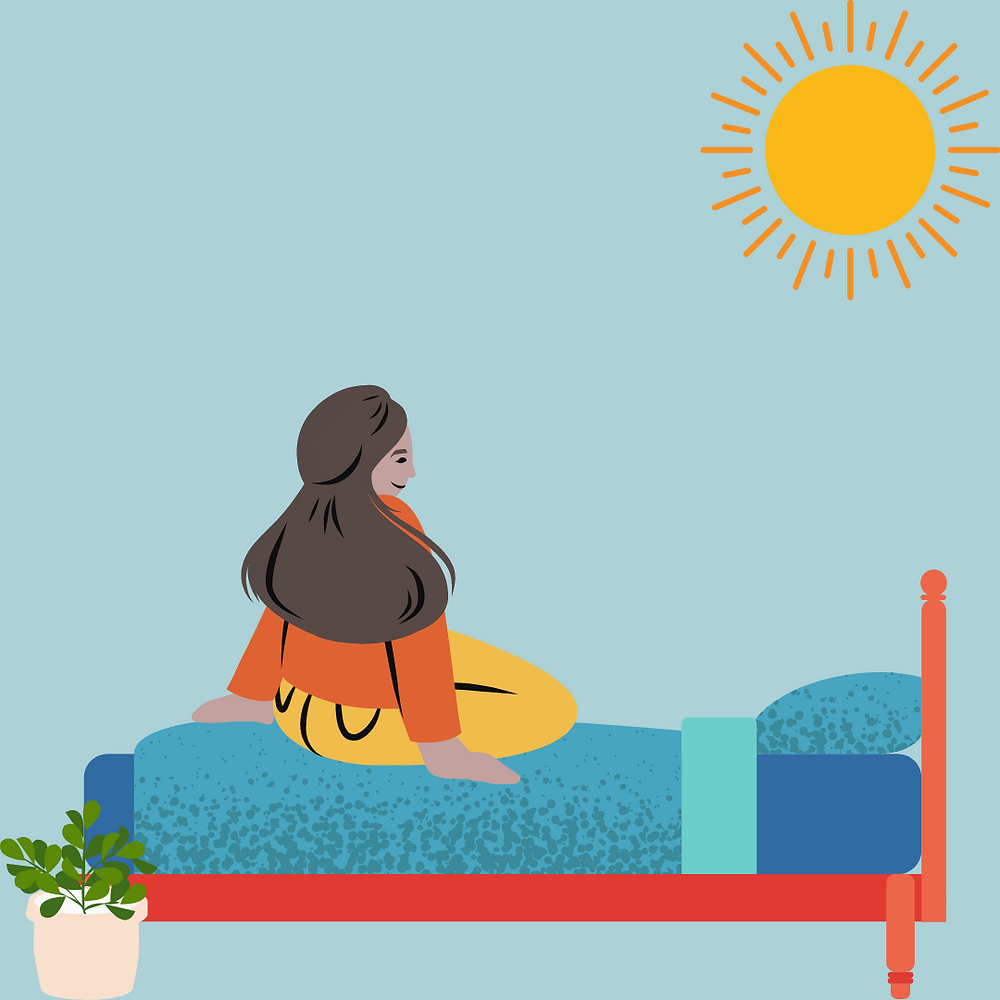 A young woman sitting on a bed with the sun out