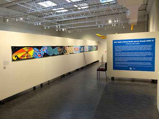 The front of the exhibit, with a long panel on the wall