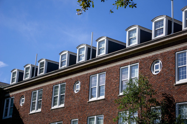 The windows of one of the quad residence halls