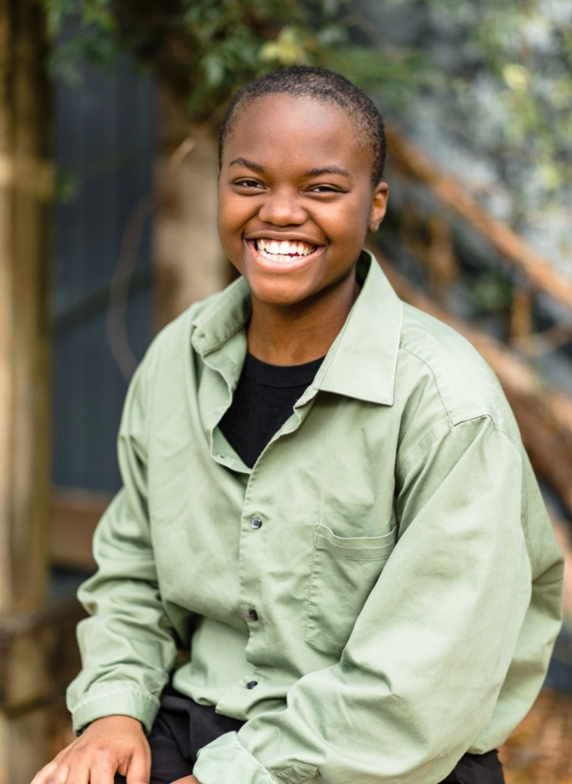 Bliss Wells in a green shirt