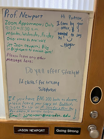 The whiteboard hanging on the door outside Prof. Newport's office, reading "do y'all offer straight lit classes for Trump supporters" amongst other messages and notes.