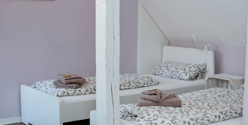 Zwei Einzelbetten in dem Zimmer "Morgensonne"