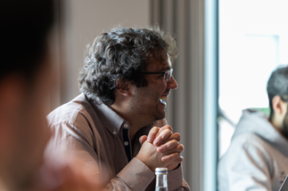 A participant laughs during the team bingo game at the quarterly meeting.