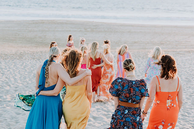 Image of Women on the Beach having a good time being together as a community,
