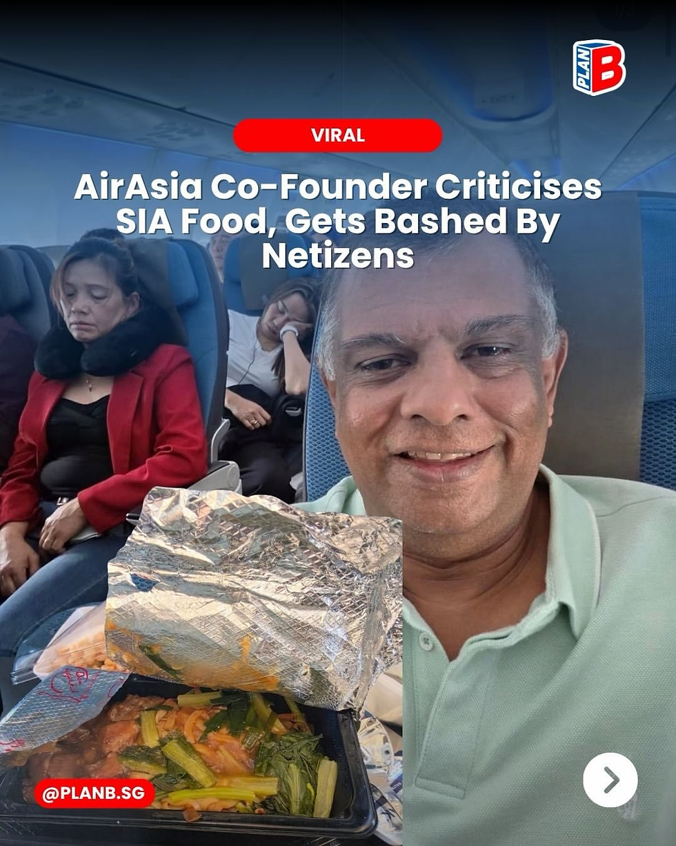 Plane selfie of a man with airline meal tray; headline says AirAsia co-founder criticises SIA food, sparking backlash.