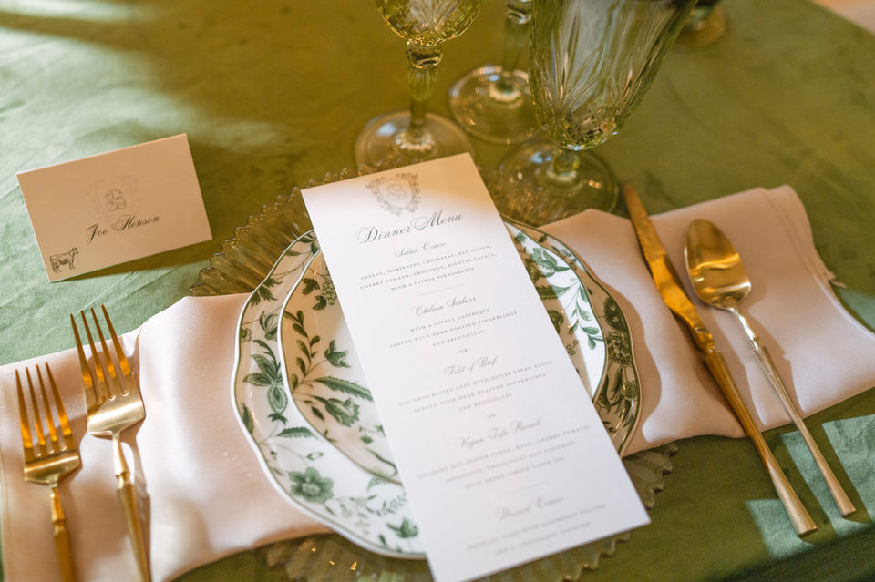 wedding reception place setting with menu and guest placecard