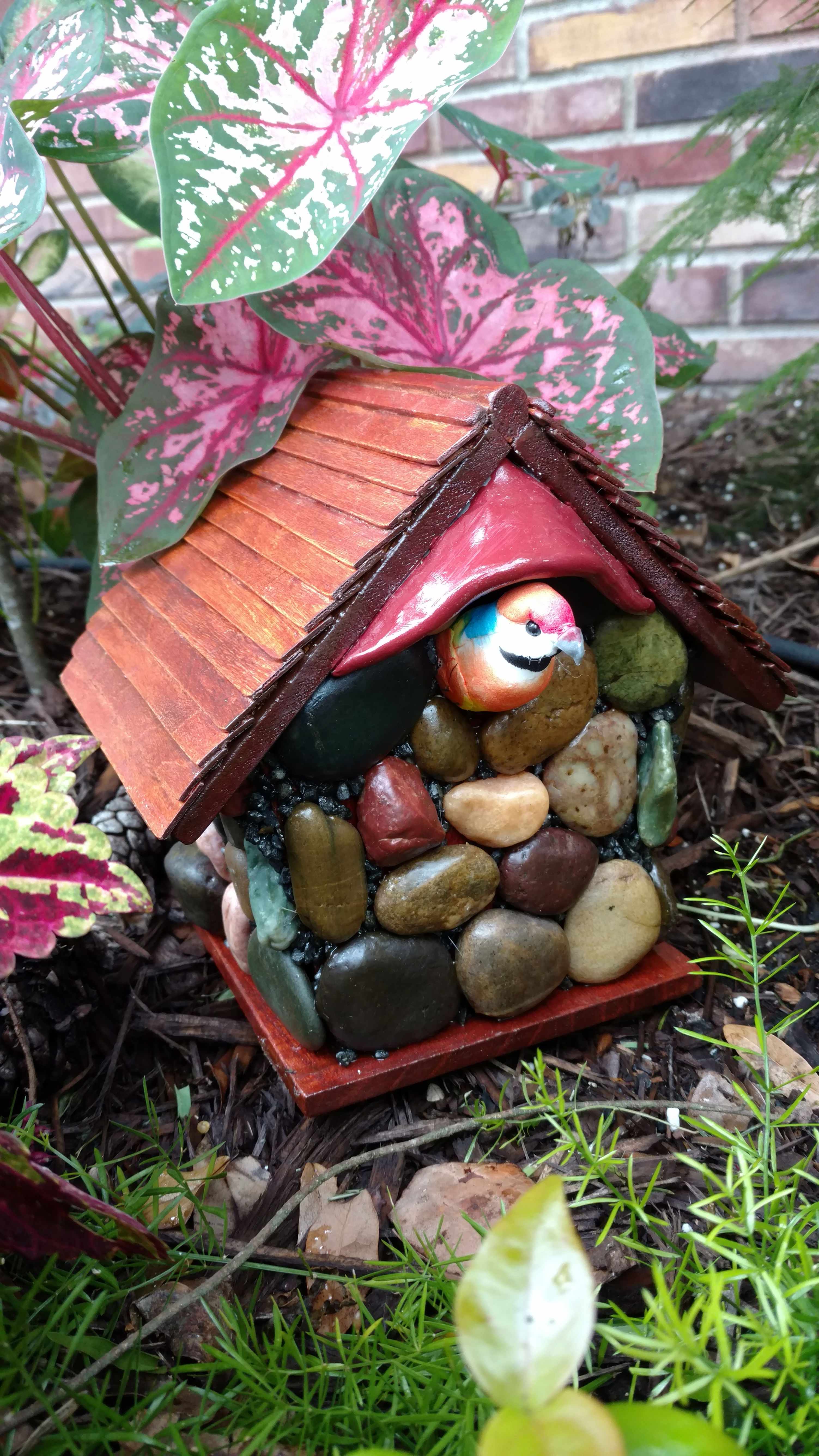 River Stone bird house with wooden roof