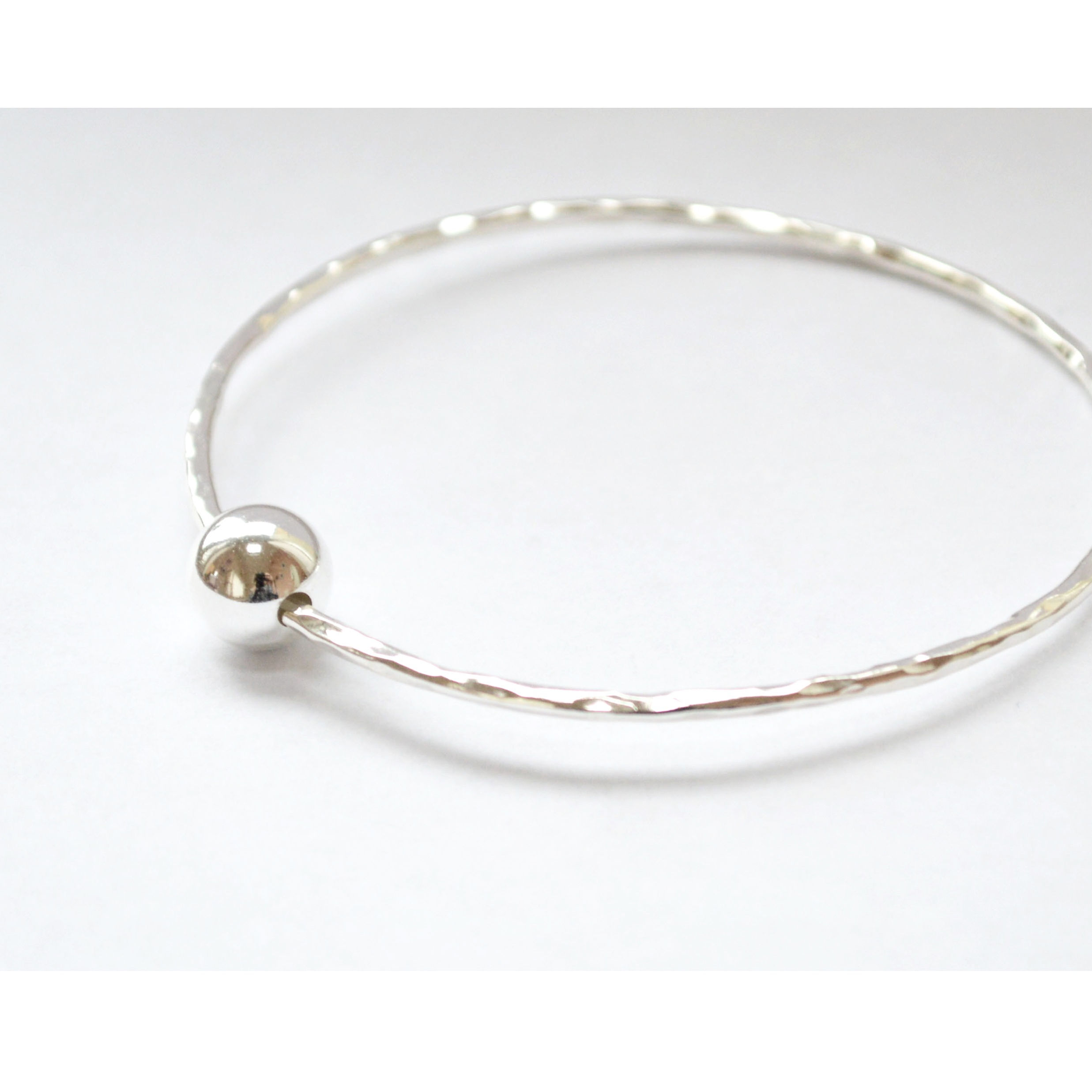 Beaten Bangle with Moving Bead