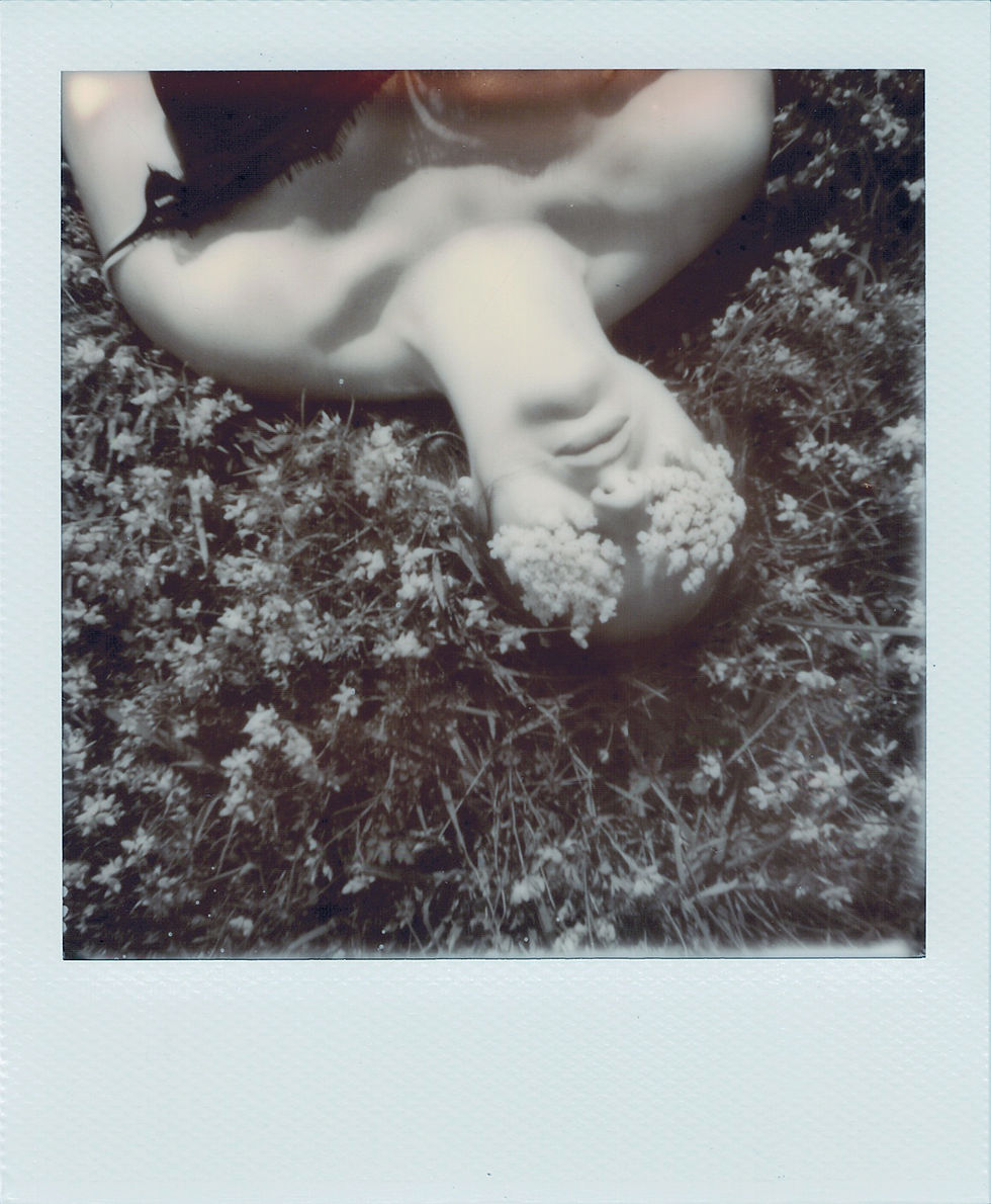 Woman lying on the grass with flowers