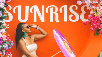 A returning Limin' Professionals guest posing at Sunrise Breakfast Party (Sunnation Events) during Trinidad Carnival, a group-favorite premium fete
