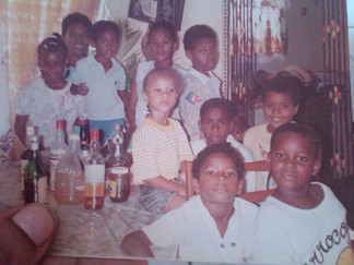 Ron Victor with extended family in Trinidad, captured at a gathering at home