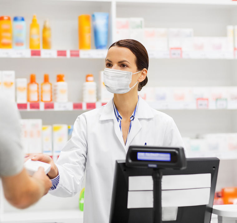 Pharmacist assists customer.jpeg