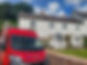 Cullompton Glass and Glazing Red Van and white house with white windows.jpg