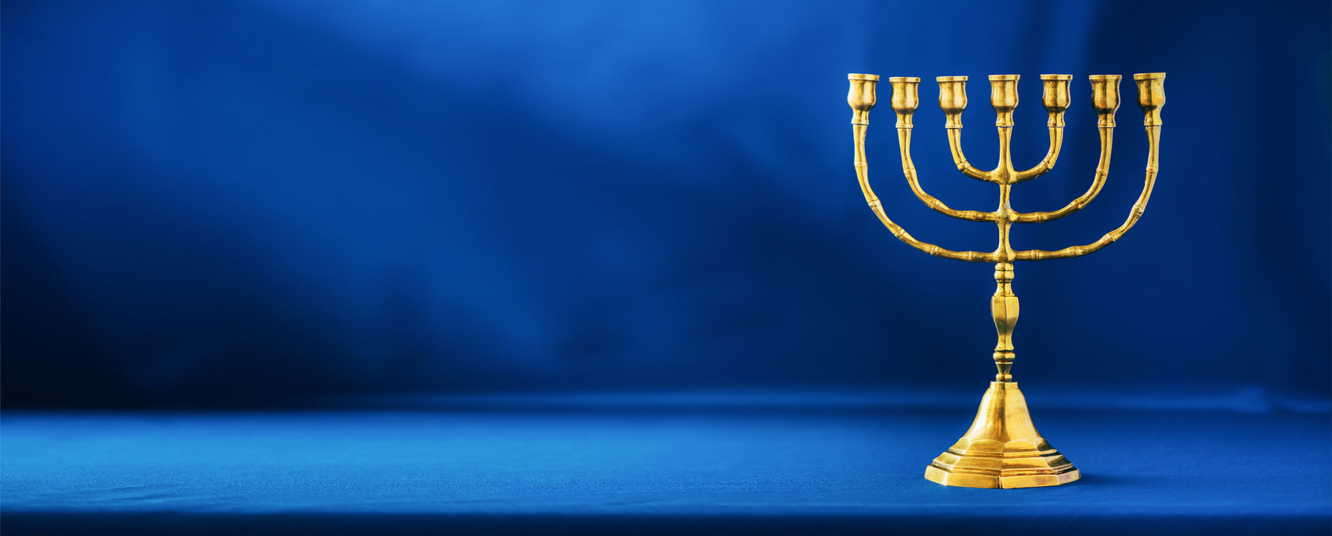 golden-hanukkah-menorah-on-blue-background-jewish-2021-09-01-16-58-04-utc.jpg