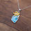 Thumbnail: Gold Sea Turtle Pendant with Larimar, Silver Larimar Pendant with Gold Turtle