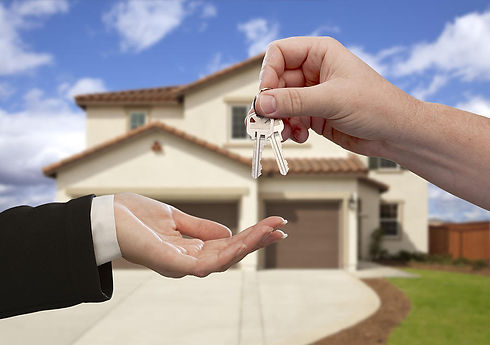 handing-over-the-house-keys-in-front-of-new-home-locksmith-denver-metro.jpg