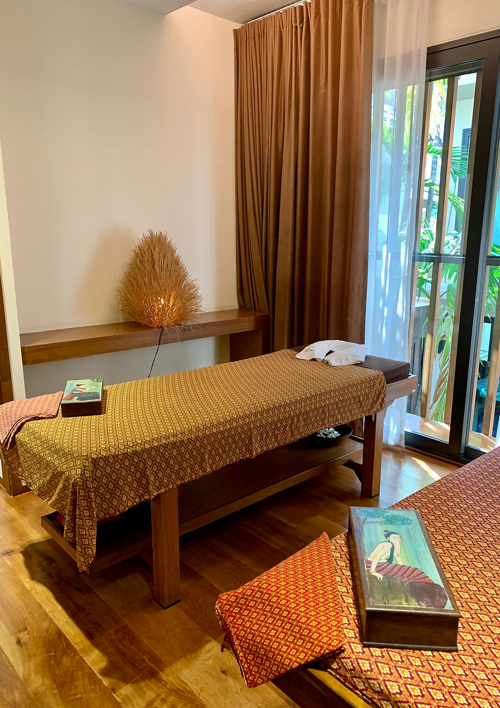 Eye-level view of a serene spa room with soft lighting and a massage bed