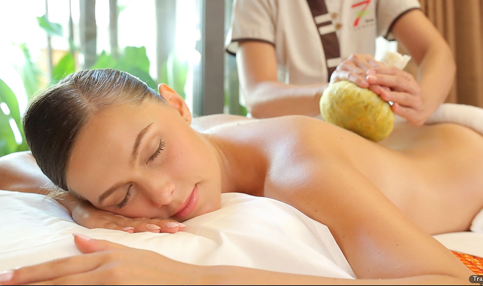 Eye-level view of a spa room with herbal compresses and massage oils
