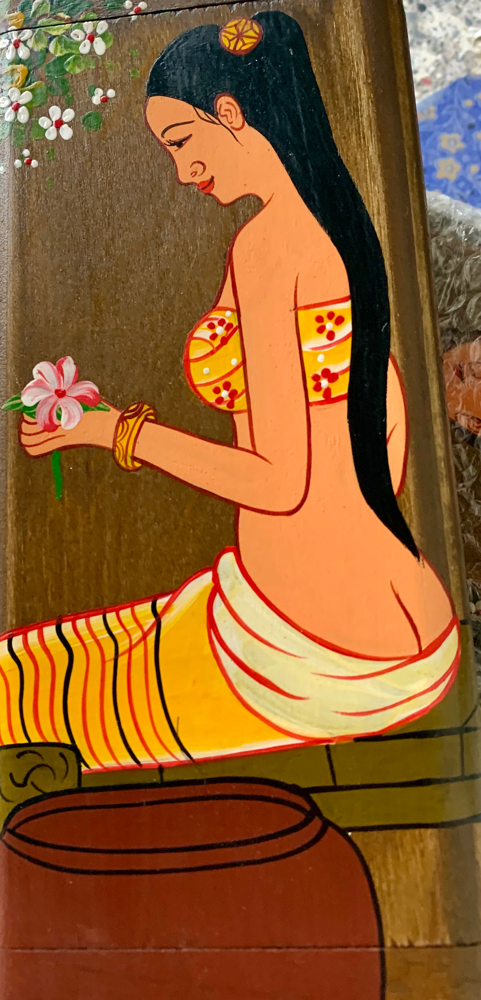 Close-up view of massage therapist applying oil on thigh for cellulite treatment