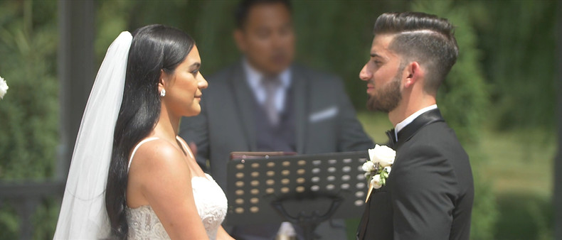 The couple looking at each other at their ceremony held at the Terrace Gazebo inside Royal Ambassador.