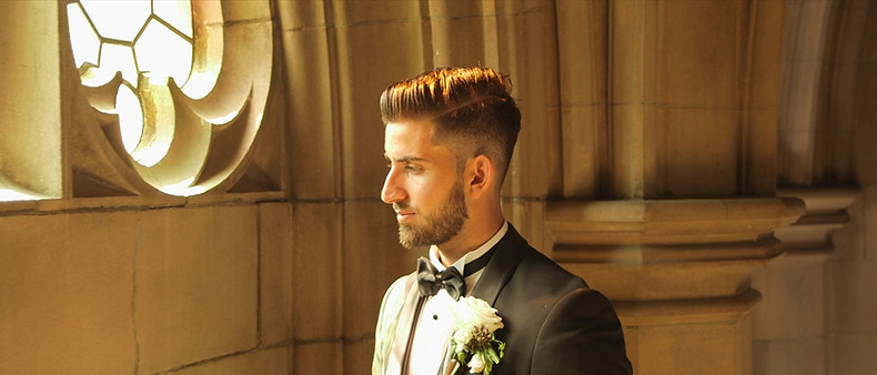Joseph poses by the window at the Knox College, inside U of T