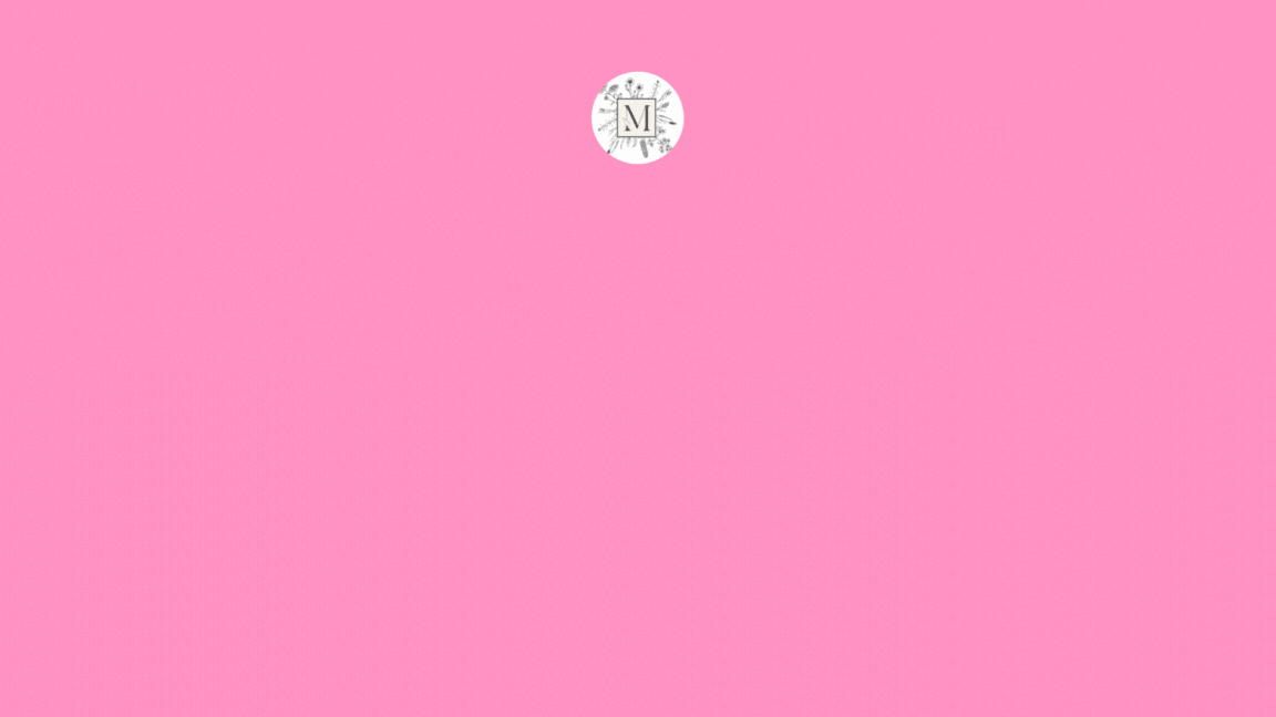 Pink background with a white circular logo featuring a letter "M" and floral design. "The Meaning of Merak" text below logo.