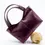 Thumbnail: Sac Lubay Scaldis Medium en Grape Skin couleur Vin bordeaux, posé en angle sur une boule décorative beige chaude