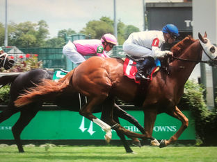 SPOOKY CHANNEL wins a tough allowance race at Churchill Downs