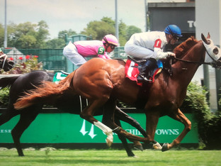 SPOOKY CHANNEL wins a tough allowance race at Churchill Downs