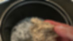 Eye-level view of HempSonch sponge being used on a Teflon pan