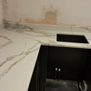 Quartz kitchen island installation with KORVA premium quartz surface