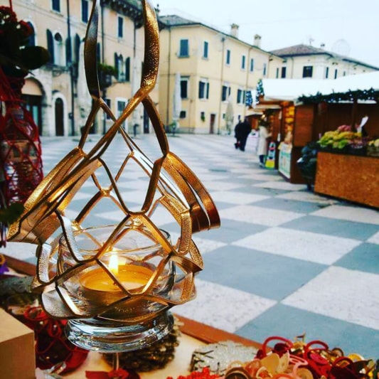 Thumbnail: wine glass sling used as candle holder