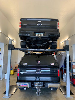 Rear View of 2 Full Size Trucks On Four 