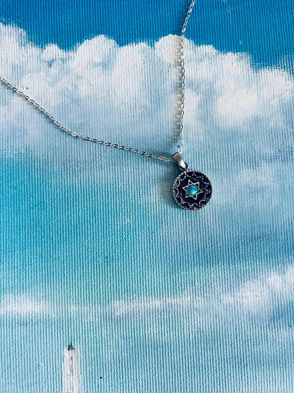 Miniatura: Wyjątkowa srebrna Gwiazda Dawida z niebieskim oczkiem