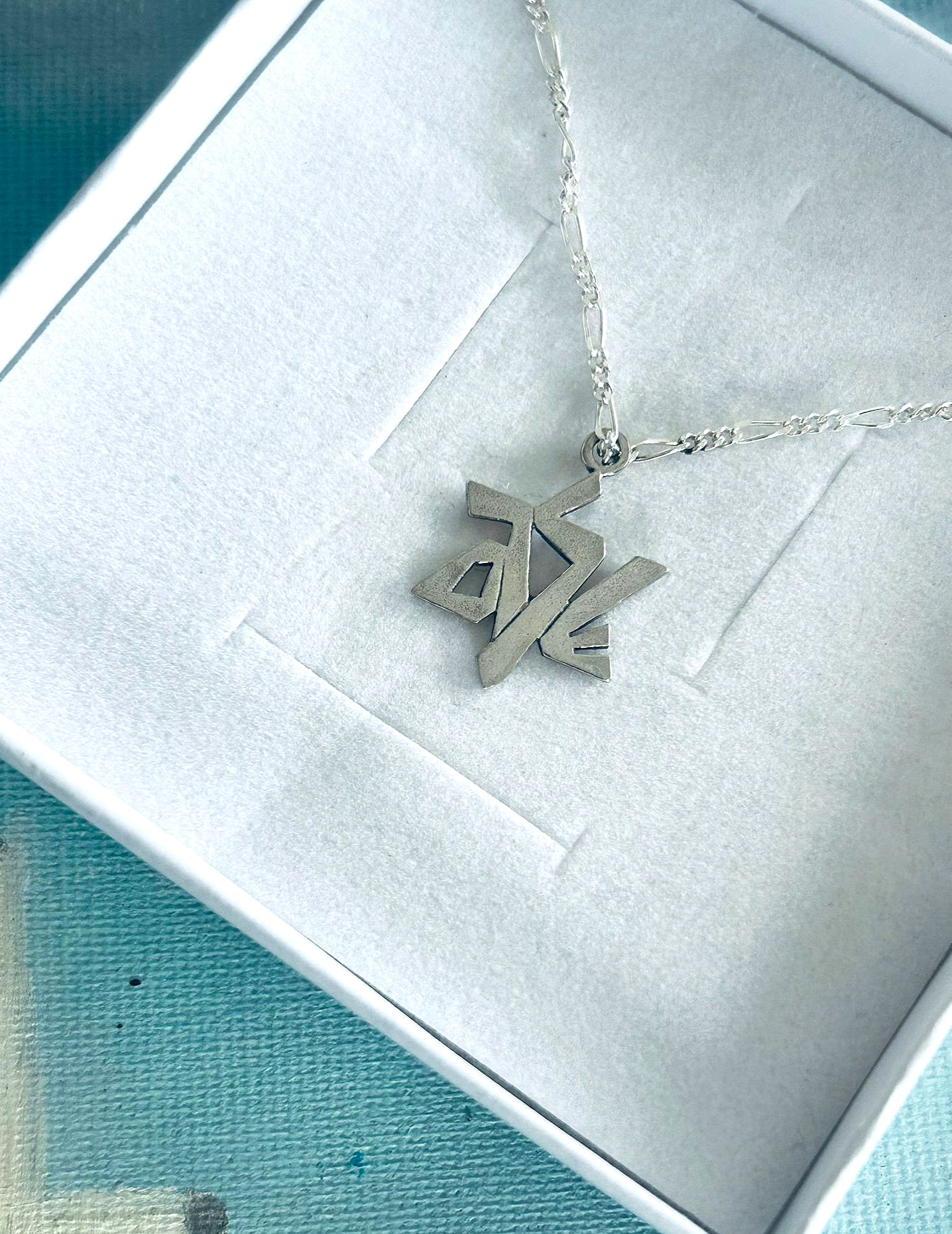 Srebrny łańcuszek z Gwiazdą Dawida z liter Shalom