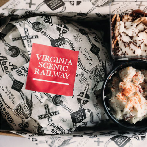Tourism specialty print projects for Virginia Scenic Railway featuring branded food packaging and onboard dining presentation.