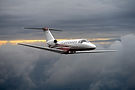 Private jet flies high above the clouds.jpg