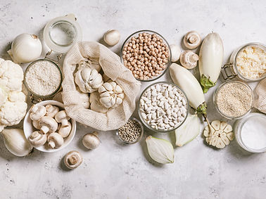White vegetables and mushrooms, rice, quinoa, legumes, white peppercorns, coconut oil on a