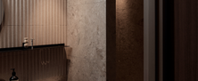 Serene Modern Ryokan bathroom with warm recessed lighting, stone texture wall tiles, and glass shower partition.