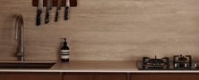 Sleek dark wood kitchen cabinets with gas cooktop backsplash rail and open display shelf nook.