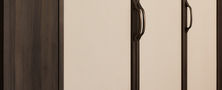 Minimalist Modern Oriental full height wardrobe featuring cream door panels trimmed in dark wood joinery with custom handles.