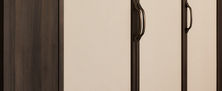 Minimalist Modern Oriental full height wardrobe featuring cream door panels trimmed in dark wood joinery with custom handles.