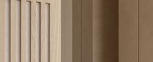 Light timber slatted partition wall transition creating visual depth between hallway and living space.